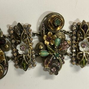 Sweet romance brand bracelet with flowers and butterflies.